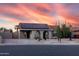 Charming single-story home with Southwestern landscaping and solar panels at dusk at 614 W Morrow Dr, Phoenix, AZ 85027