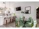 Open kitchen and dining area with island seating and a modern aesthetic at 614 W Morrow Dr, Phoenix, AZ 85027