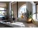 Bright kitchen sink features views of lush greenery through an arched window at 614 W Morrow Dr, Phoenix, AZ 85027