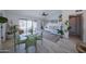 Bright living room with sliding glass doors to the pool, tile floors, and vaulted ceilings at 614 W Morrow Dr, Phoenix, AZ 85027