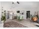 Open-concept living and dining area boasts modern fixtures and stylish decor with lots of natural light at 614 W Morrow Dr, Phoenix, AZ 85027