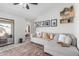 Cozy living room features plush sofa, stylish decor, and open access to a bedroom at 614 W Morrow Dr, Phoenix, AZ 85027