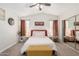 Comfortable bedroom with white bedding, neutral walls, and mirrored closet for a spacious feel at 614 W Morrow Dr, Phoenix, AZ 85027