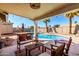Inviting patio with outdoor seating around a pool and spa, perfect for relaxing at 614 W Morrow Dr, Phoenix, AZ 85027