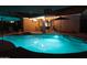 Inviting outdoor pool area illuminated at night with patio dining and lounge seating at 614 W Morrow Dr, Phoenix, AZ 85027