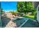Relaxing backyard boasts a manicured lawn, paved patio, and cozy seating arrangement with a fire pit at 6814 N 11Th St, Phoenix, AZ 85014