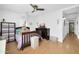 Charming bedroom with a ceiling fan, comfortable bed, and a view of the en-suite bathroom at 6814 N 11Th St, Phoenix, AZ 85014