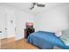 Cozy bedroom with a serene atmosphere, featuring a comfortable bed, a TV, and a ceiling fan for added comfort at 6814 N 11Th St, Phoenix, AZ 85014
