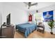 Relaxing bedroom featuring a comfortable bed, ceiling fan, a TV, and decorations for added comfort at 6814 N 11Th St, Phoenix, AZ 85014