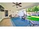 Relaxing covered patio with wicker seating, ceiling fan, and view of the backyard at 6814 N 11Th St, Phoenix, AZ 85014