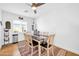 Bright dining area with white and brown table set, ceiling fan, and large window at 6814 N 11Th St, Phoenix, AZ 85014