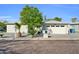Charming single-story home featuring well-maintained landscaping and an attached two-car garage at 6814 N 11Th St, Phoenix, AZ 85014