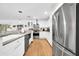 Spacious kitchen with stainless steel appliances, white cabinets, and views to the dining area at 6814 N 11Th St, Phoenix, AZ 85014