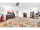 Spacious bedroom with a large bed, TV, and sitting area with a ceiling fan providing a comfortable ambiance at 6814 N 11Th St, Phoenix, AZ 85014