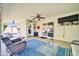 Cozy covered patio with ceiling fans, tv, and comfortable wicker furniture at 6814 N 11Th St, Phoenix, AZ 85014