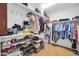 Well-organized walk-in closet with built-in shelving for shoes and clothing at 6814 N 11Th St, Phoenix, AZ 85014