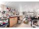 Spacious garage featuring a pegboard wall, cabinets, and a workbench area for various projects and storage solutions at 757 S 82Nd Way, Mesa, AZ 85208