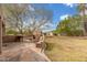 Backyard with a stucco fireplace, built-in grill, and expansive patio space at 8126 E Vista Bonita Dr, Scottsdale, AZ 85255