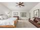 Bright primary bedroom featuring neutral walls, large windows, and comfortable seating area at 8126 E Vista Bonita Dr, Scottsdale, AZ 85255