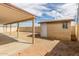 Backyard view featuring a storage shed and covered patio, perfect for enjoying outdoor living at 8541 N 112Th Ave, Peoria, AZ 85345