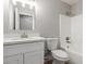 Clean bathroom with white vanity, toilet, tub, shower and neutral wall color at 8541 N 112Th Ave, Peoria, AZ 85345