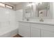 Bright bathroom with double sinks, quartz counters and modern fixtures at 8541 N 112Th Ave, Peoria, AZ 85345