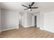Spacious bedroom features a modern ceiling fan and light, and wood-look flooring at 8541 N 112Th Ave, Peoria, AZ 85345