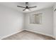 Bedroom featuring neutral carpeting, a ceiling fan, and a window at 8541 N 112Th Ave, Peoria, AZ 85345