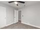 Bedroom featuring neutral carpeting, a ceiling fan, and white trim at 8541 N 112Th Ave, Peoria, AZ 85345