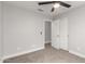 Bedroom featuring neutral carpeting, a ceiling fan, and closet doors at 8541 N 112Th Ave, Peoria, AZ 85345