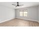 Spacious bedroom with neutral walls, a window, and wood-look flooring at 8541 N 112Th Ave, Peoria, AZ 85345