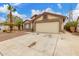 Charming single-Gathering home with a two-car garage, desert landscaping, and a palm tree at 8541 N 112Th Ave, Peoria, AZ 85345