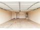 Spacious garage features ample room for storage and parking with a water heater and utility access at 8541 N 112Th Ave, Peoria, AZ 85345