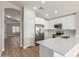 Modern kitchen with stainless steel appliances and white cabinets at 8541 N 112Th Ave, Peoria, AZ 85345