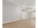 Bright, open living room featuring wood-style flooring and a white front door at 8541 N 112Th Ave, Peoria, AZ 85345