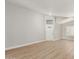 Bright living room featuring wood floors and a modern front door at 8541 N 112Th Ave, Peoria, AZ 85345