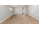 Bright and open living area featuring wood flooring, modern design, and natural light at 8541 N 112Th Ave, Peoria, AZ 85345