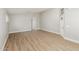 Spacious living room showcasing wood floors, natural light, and neutral paint at 8541 N 112Th Ave, Peoria, AZ 85345