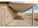 Home's covered patio area, with desert landscaping, a view of the backyard, and bright natural light at 8541 N 112Th Ave, Peoria, AZ 85345