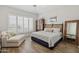 Comfortable bedroom with lots of natural light, a ceiling fan, and luxury wood-look flooring at 9390 N 115Th St, Scottsdale, AZ 85259
