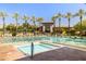 Beautiful community pool with lap lanes, a jacuzzi, and mature palm trees at 9390 N 115Th St, Scottsdale, AZ 85259