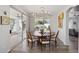 Dining room featuring a wood table, chandelier, and sliding doors to a covered outdoor patio at 9390 N 115Th St, Scottsdale, AZ 85259