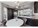 Open kitchen with an island, dark wood cabinetry, stainless steel appliances, and a breakfast nook at 9390 N 115Th St, Scottsdale, AZ 85259