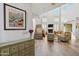 Bright living room with high ceilings, a fireplace, clerestory windows and wood look flooring at 9390 N 115Th St, Scottsdale, AZ 85259