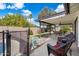 Inviting covered patio with outdoor seating overlooking a manicured backyard, ideal for relaxing and entertaining at 1002 E Grandview Rd, Phoenix, AZ 85022