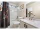 Well-maintained bathroom with a shower-tub combo, vanity, and ample lighting, ideal for daily routines at 1002 E Grandview Rd, Phoenix, AZ 85022