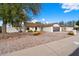 Charming single-story home features a low-maintenance desert landscape and a two-car garage at 1002 E Grandview Rd, Phoenix, AZ 85022
