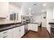 Bright kitchen with modern appliances, granite countertops, and seamless flow to living area, perfect for entertaining at 1002 E Grandview Rd, Phoenix, AZ 85022