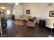 Inviting living room with dark wood floors, neutral walls, and a comfortable seating arrangement at 1002 E Grandview Rd, Phoenix, AZ 85022