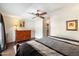 Comfortable main bedroom with hardwood floors, ceiling fan, and ample closet space at 1002 E Grandview Rd, Phoenix, AZ 85022